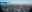 City skyline with snow seen from airplane window.